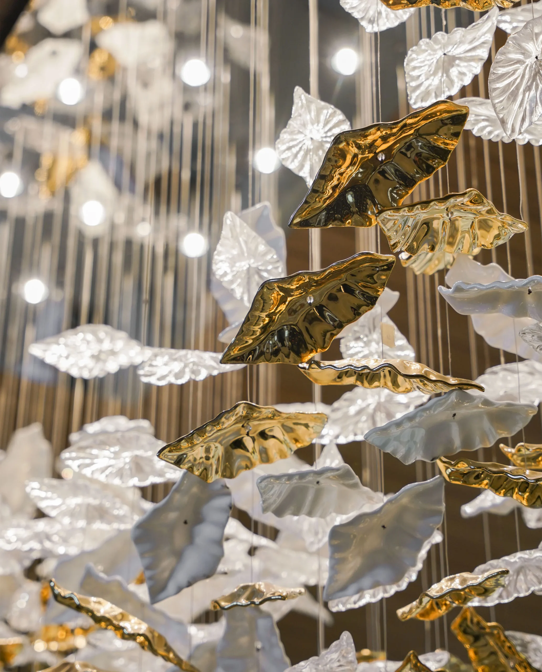 Folli suspended gold and crystal leaf detail