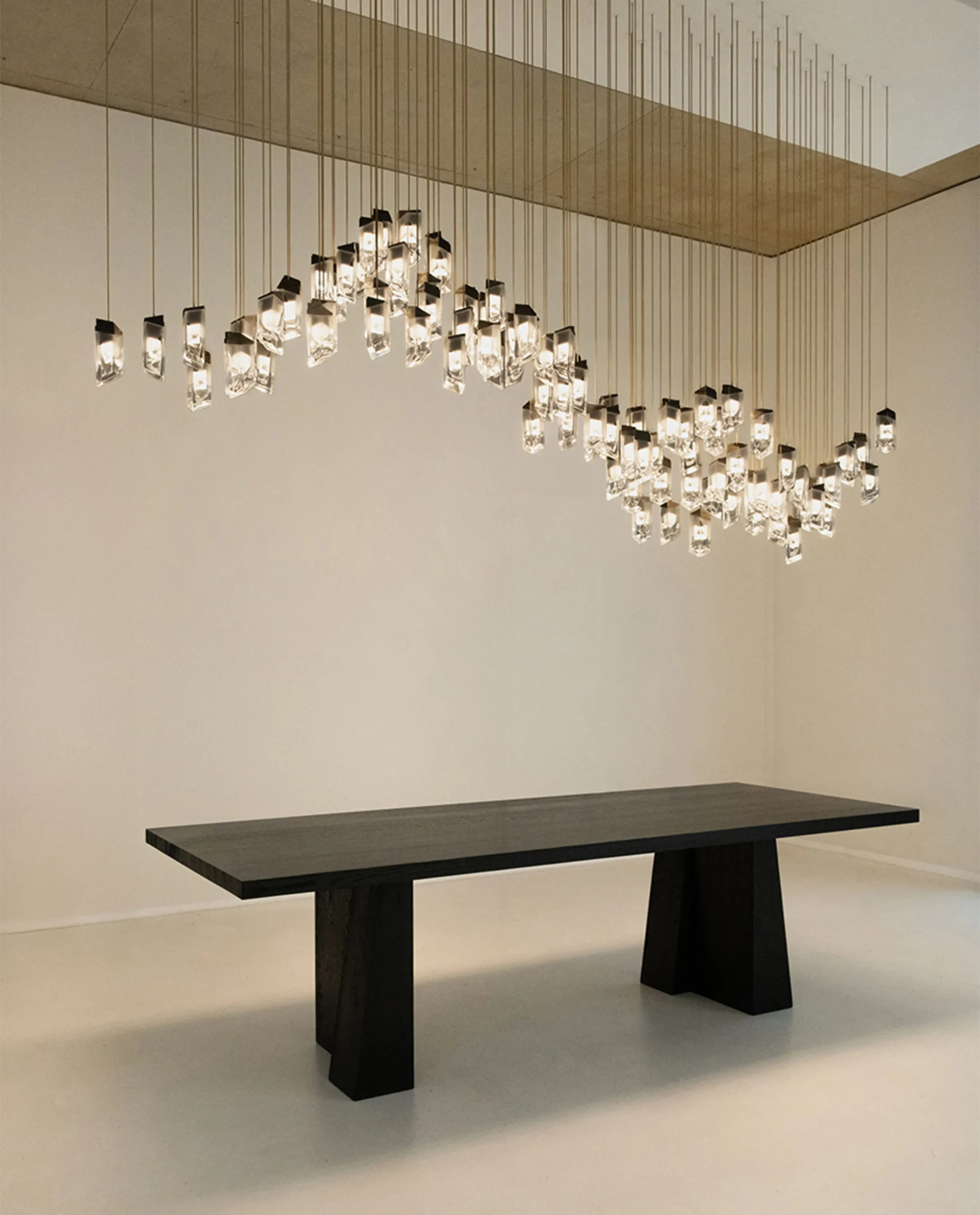 Crystel chandelier formation composition over dining table