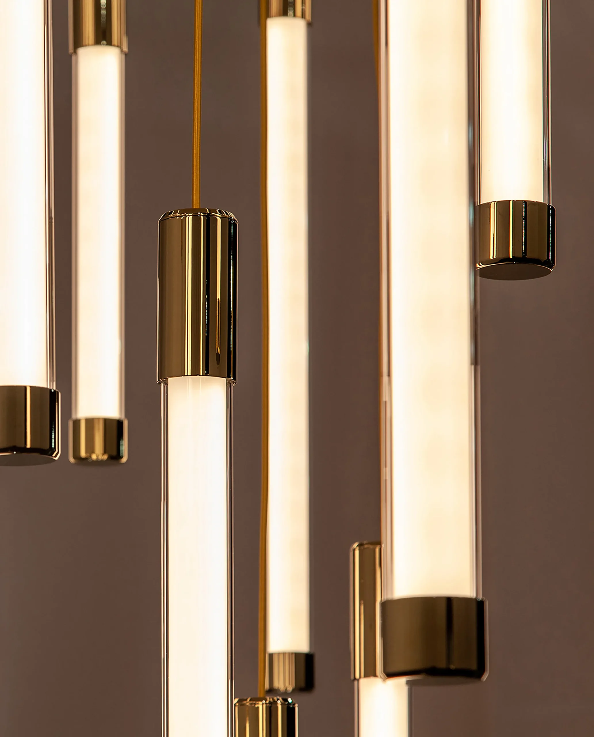 Yarden chandelier gold tube close-up Bloom Lighting