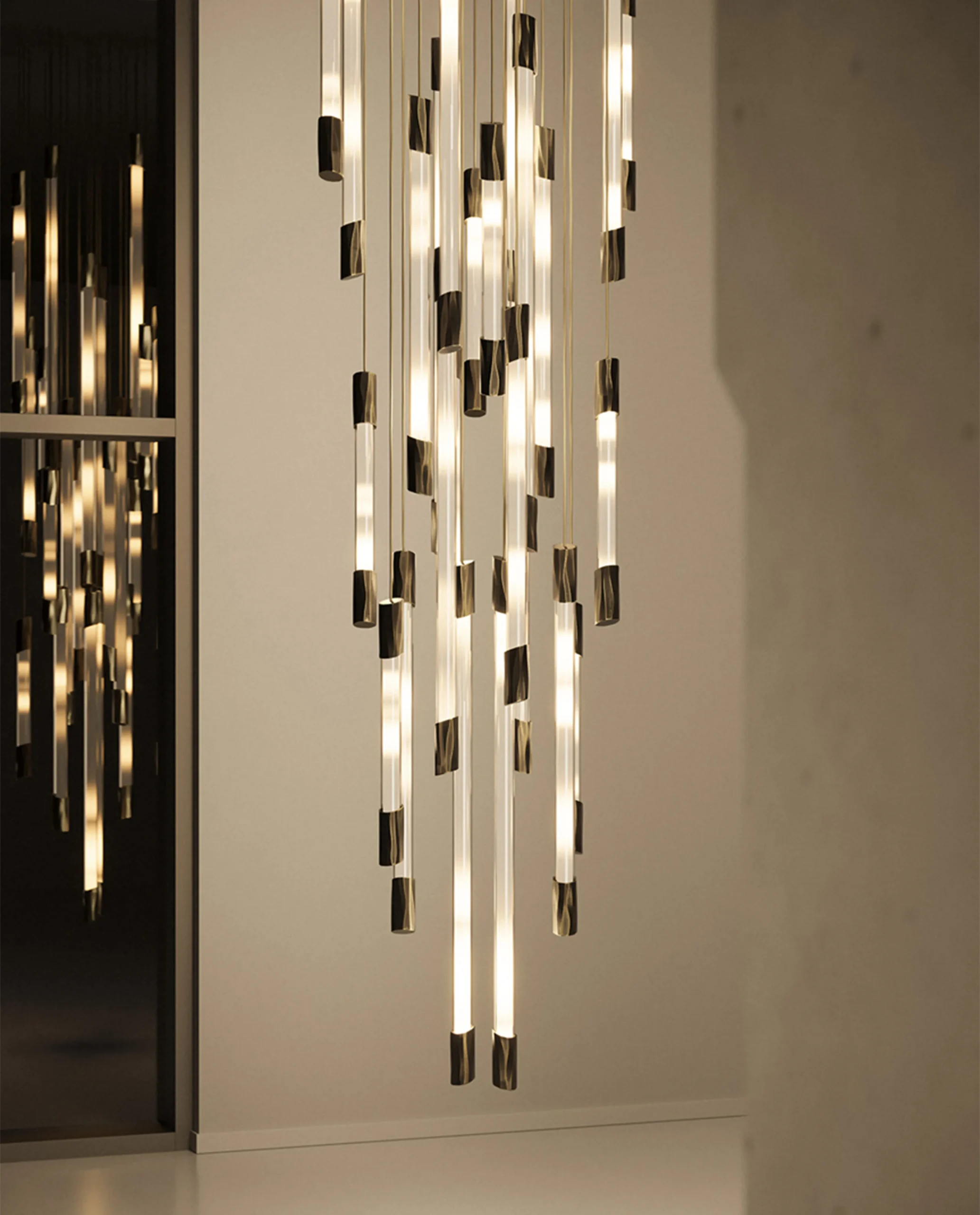 Yarden chandelier helix composition installed in luxury stairwell