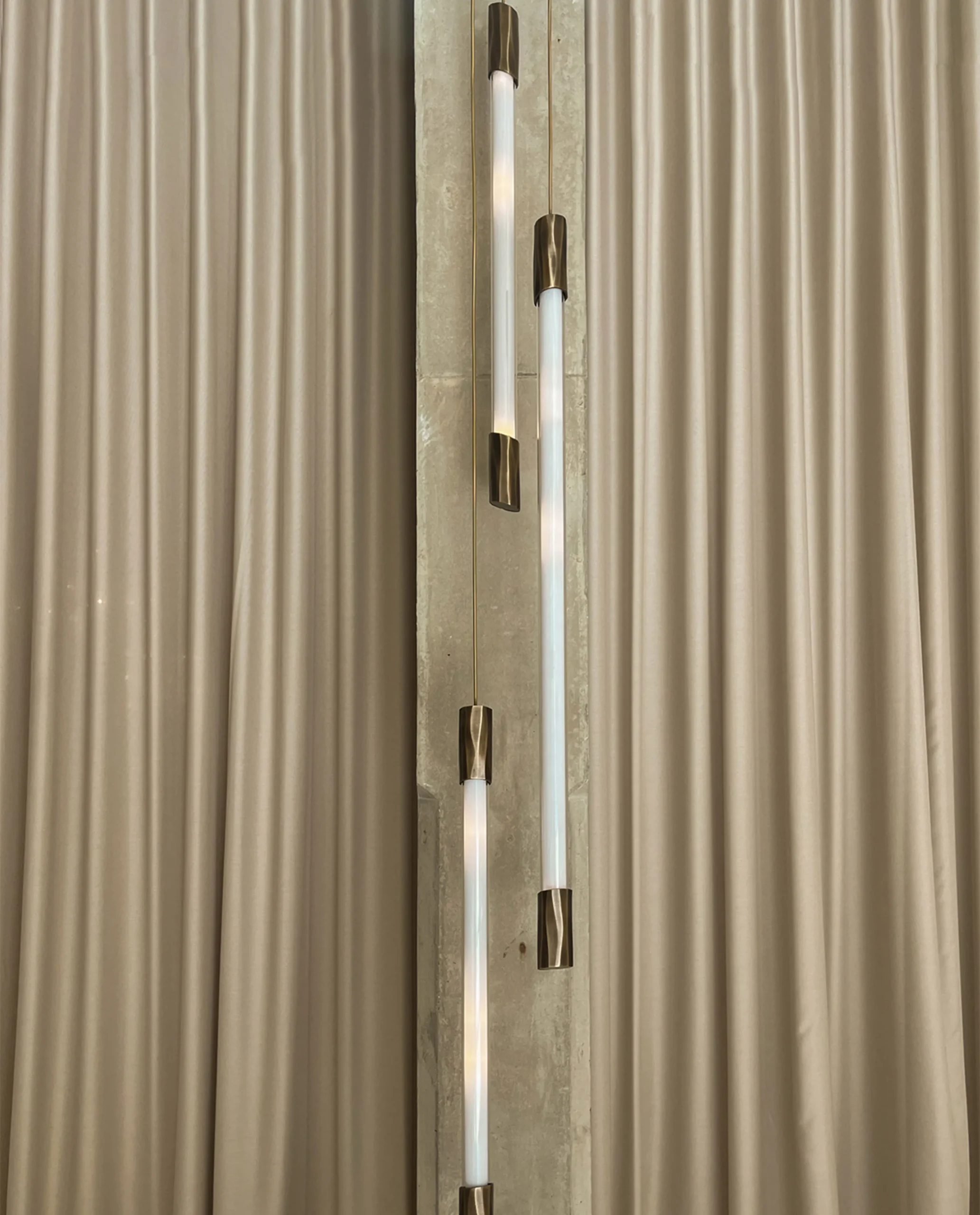 Yarden chandelier gold tube cascade in luxury interior